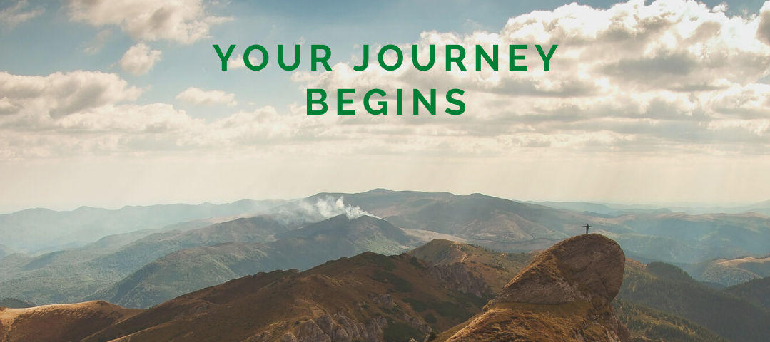Mountain top view with the text “your journey begins”