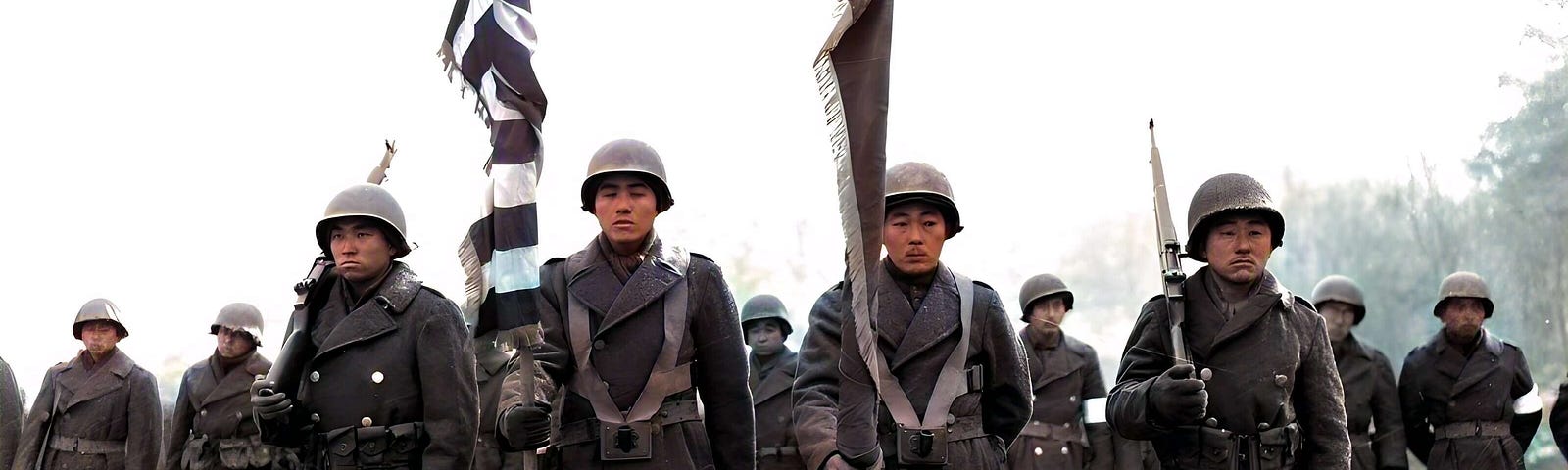 Two color guards and color bearers of the Japanese-American 442d Combat Team, stand at attention, while their citations are read. They are standing on ground in the Bruyeres area, France, where many of their comrades fell.