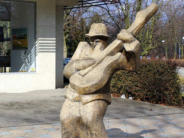 Sculpture of older guitar player!
