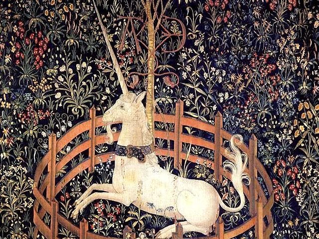 an ancient tapestry depicting a unicorn in captivity