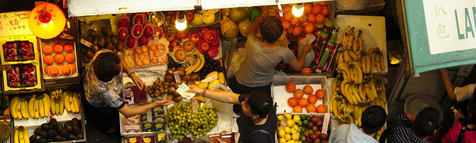 Overhead photo of people in a food market.