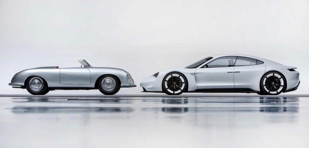 Two cars facing each other, on the left an old Porsche 356, on the right the electric prototype Mission E of 2018