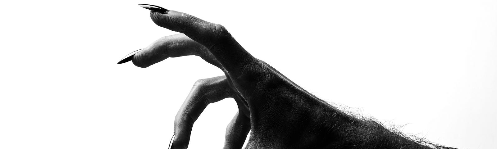 A dark clawed hand reaches sinisterly against a white background.