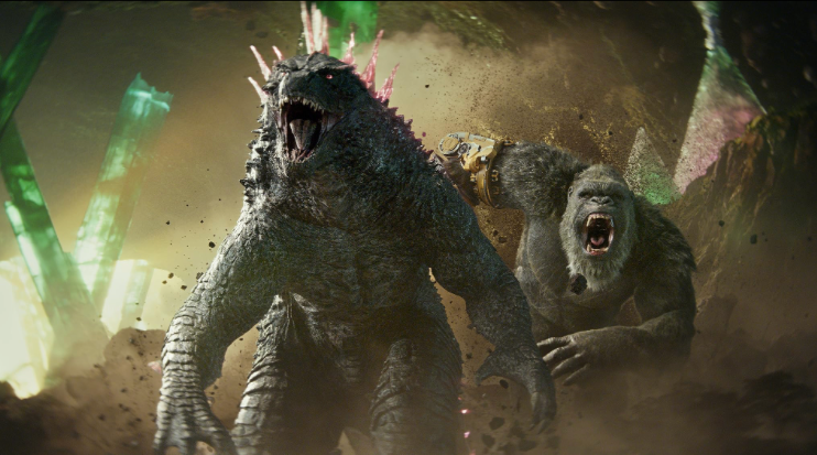 A reptilian monster, Godzilla, is on the left, he is huge and has glowing spikes going down his back. On the right is a gigantic ape, King Kong. Godzilla, movie reviews, film, classic, Godzilla vs. Kong: The New Empire.