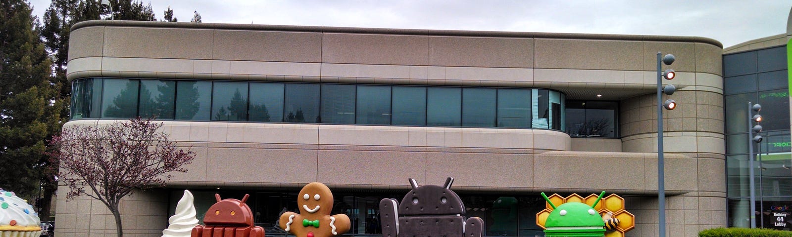 A photo of Android dessert sculptures celebrating Android OS releases in front of Google Building 44 in Mountain View, CA.