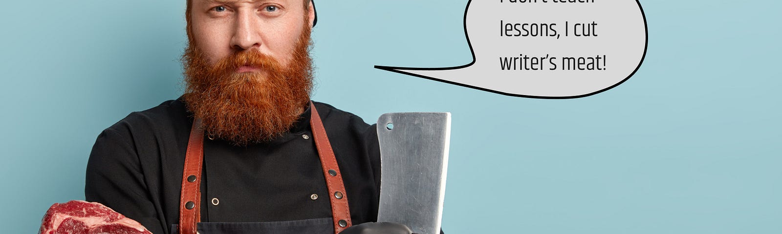 Man with ginger beard in apron and gloves holding knife and meat.