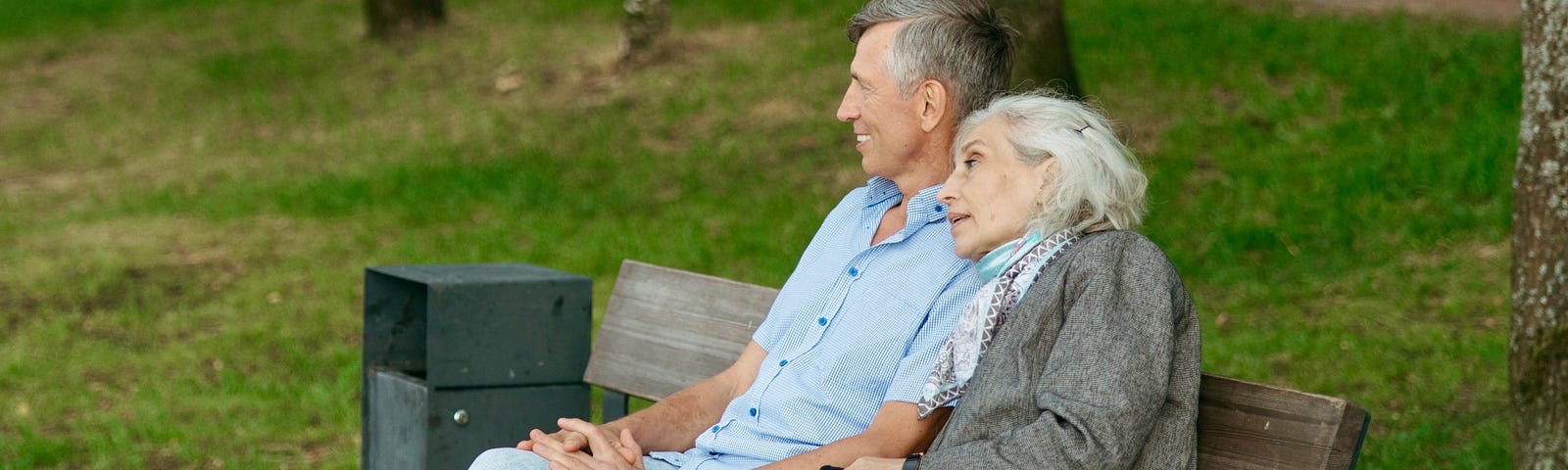 elderly-couple-seated-on-a-bench