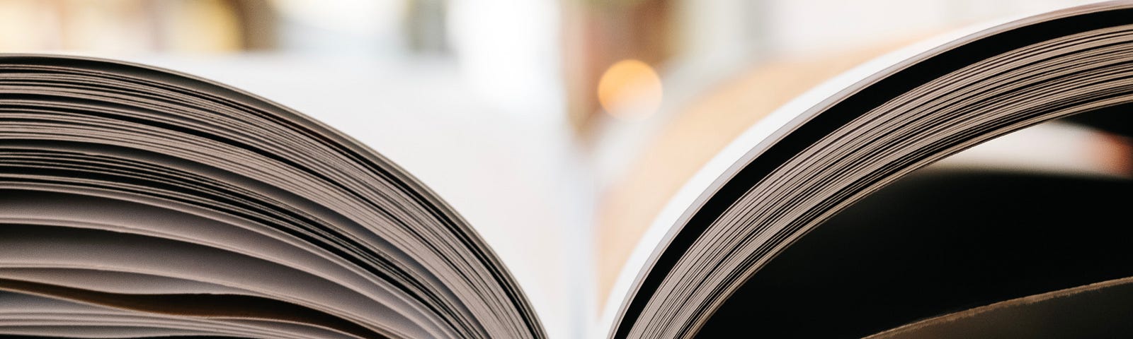 A book is spread open on a table.