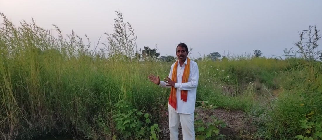 Farmer in Jalna explaining how the recharge pit in his plot saved his soy bean crops from spoilage