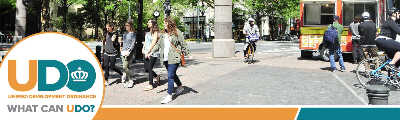 People walking, biking in streets of Uptown Charlotte