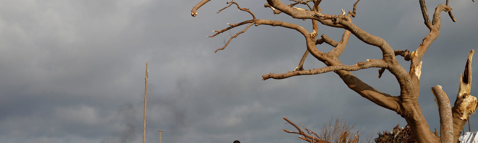 A man walks among debris at the Mudd neighborhood after Hurricane Dorian hit the Abaco Islands, Bahamas, September 6, 2019