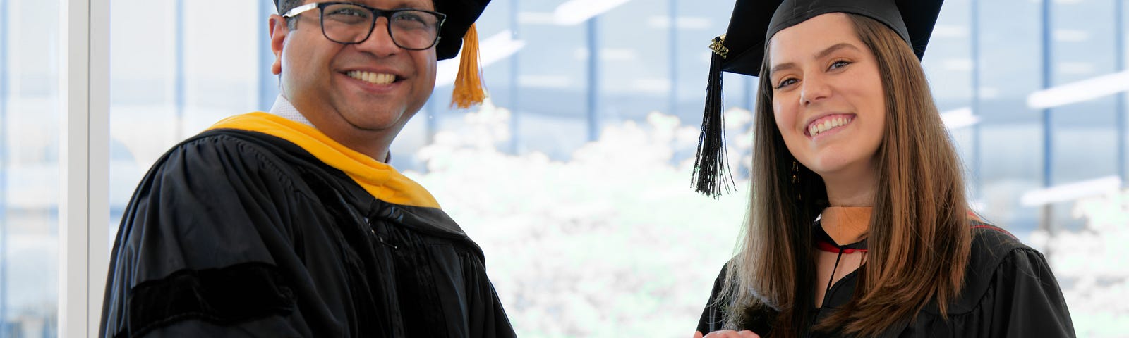 Interim Dean Anijo Mathew awarding a diploma to Monica Villazon San Martin