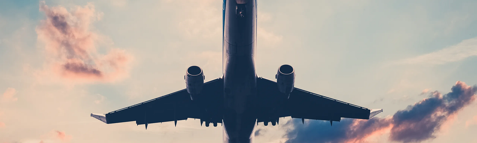 a plane taking off during sunset