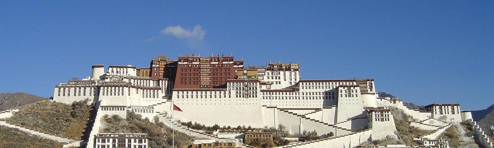 Front view image of the famed Potala Palace. The image is taken from across the main plaza, which did not exist until more recently.