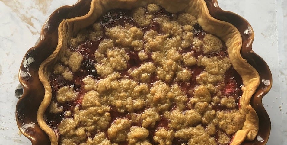 Blackberry pie with a crumble topping and a scalloped edge