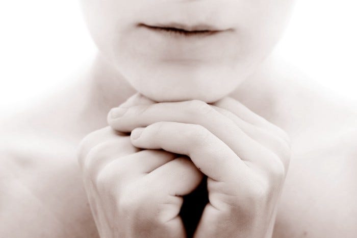 woman’s face with hands under her chin, open letter to people who hurt you article on Medium