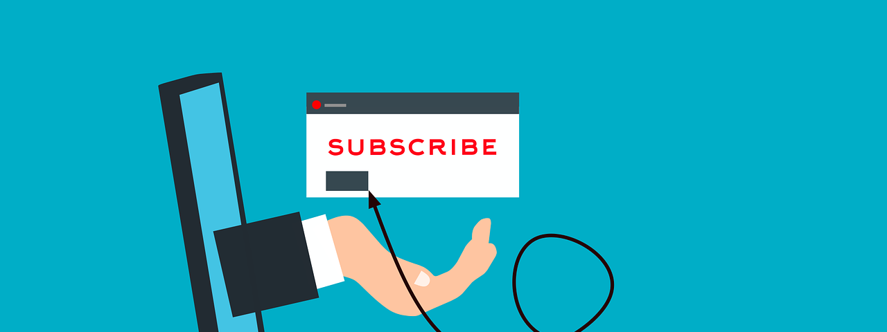 IMAGE; A drawing of an open laptop on a blue background, with a hand coming out of the screen with a sign reading “SUBSCRIBE”