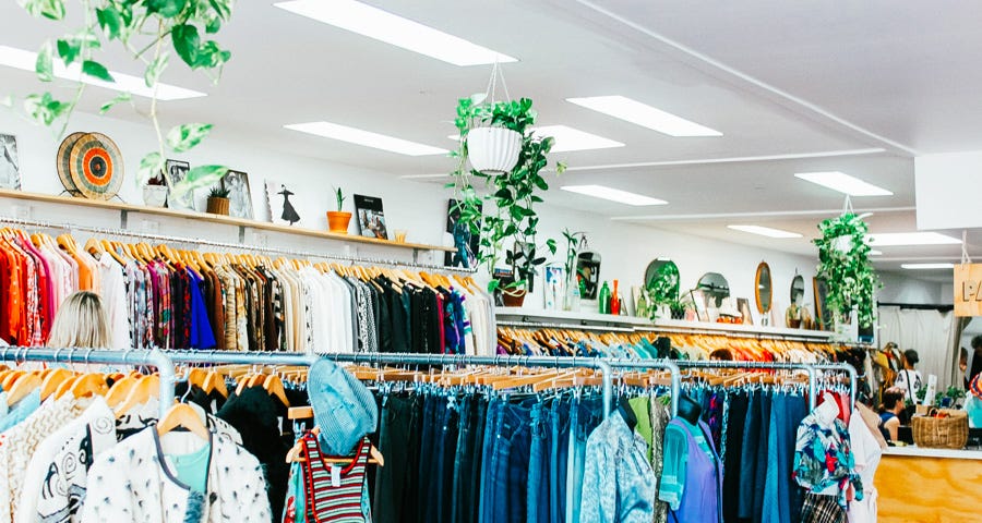 A thrift shop with womens clothing and jeans