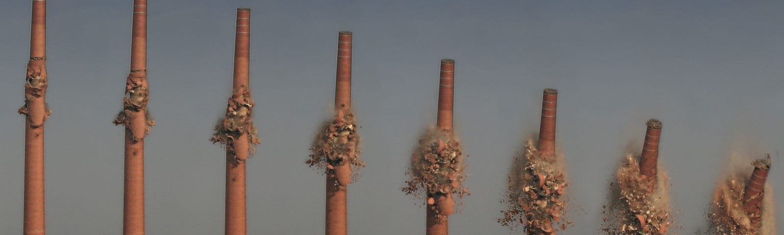 An image of a set of chimneys being demolished