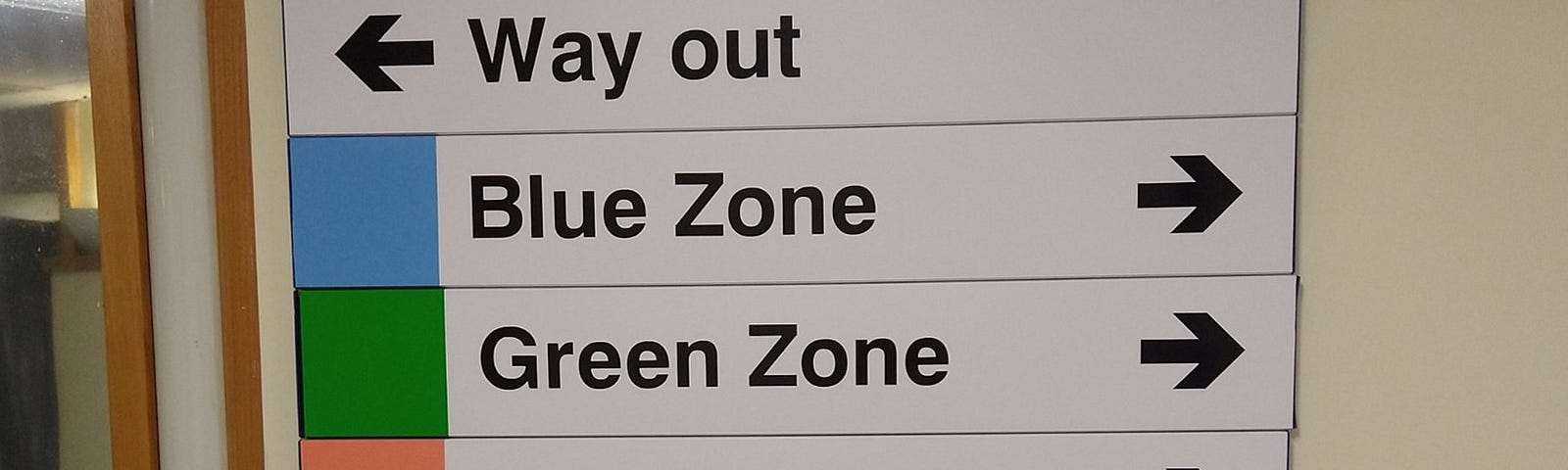 A photograph of directions to Zones within the William Harvey Hospital in Ashford, Kent, England. We were headed to the Pink Zone