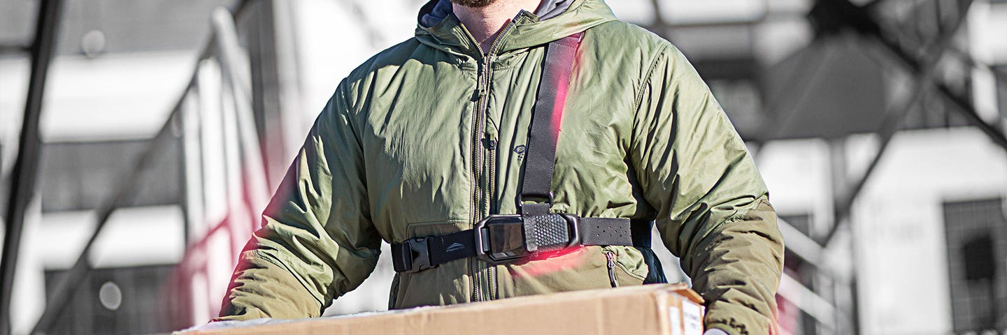 Essential worker wearing the FUSE in order to stay safe while on the job.