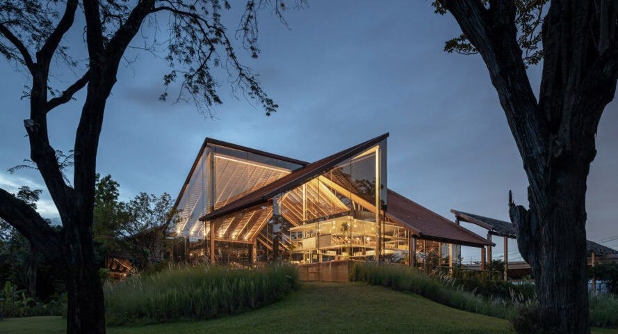 This solar-powered cafe in Thailand blends into the environment with reflective glass