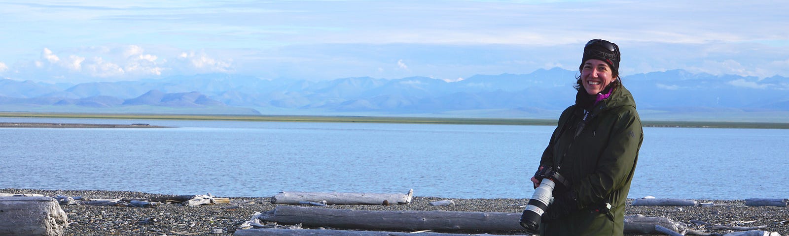 Danielle Brigida, with camera in hand, is happy to be bird watching in Alaska’s wilderness.