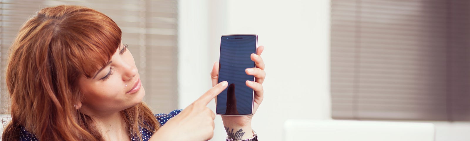 Woman touching smartphone screen