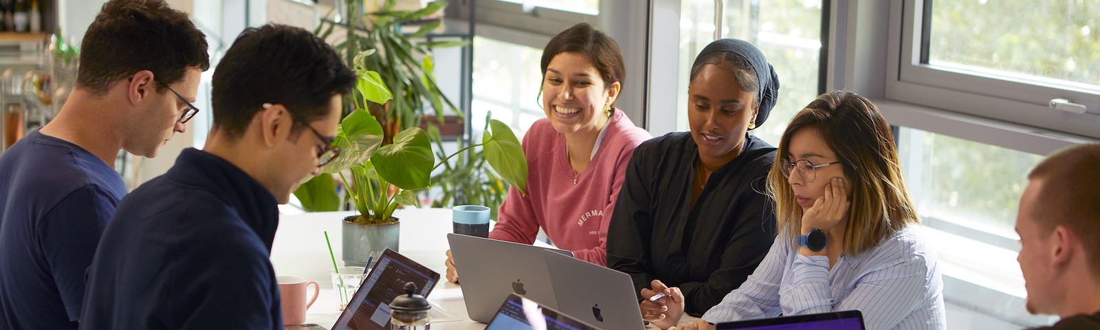 A team planning session around a desk