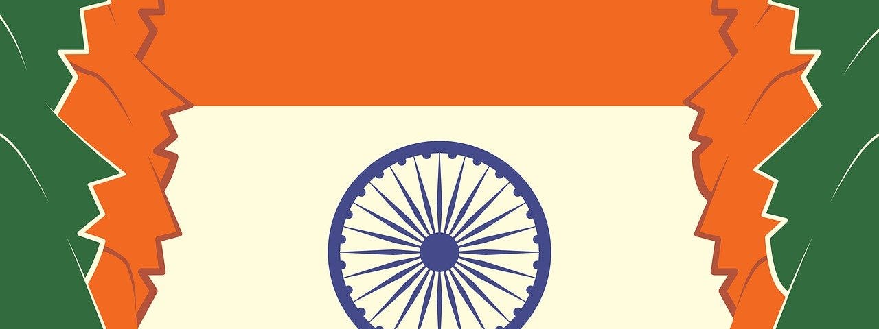 IMAGE: Indian national flag fitted on a square shaped backdrop with human head profiles on both sides