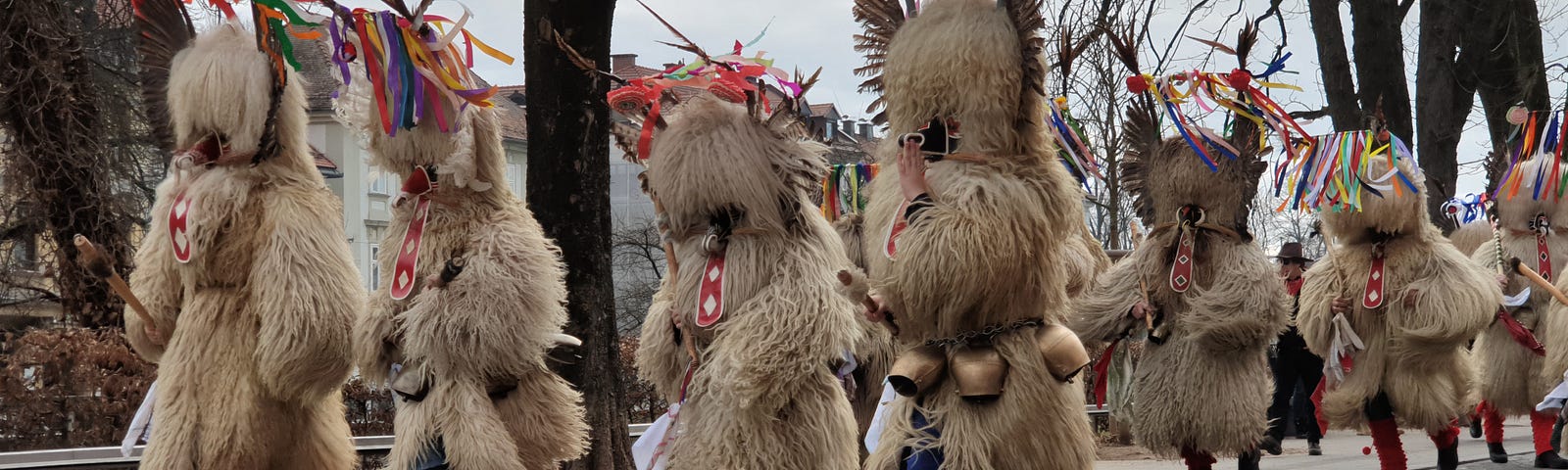 Kurenti or carnival creatures in Ljubljana, Slovenia. They are men dressed up in sheepskin with headdresses and bells on their belts.
