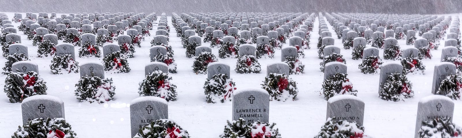 Photo of a veterans cemetery during a snowstorm.