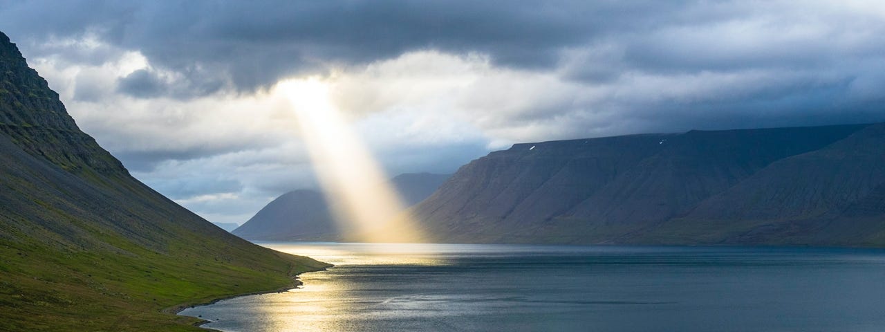 A ray of sunlight shining on a lake