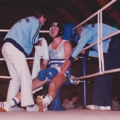 The author sitting on his stool between rounds of a boxing bout, looking exhausted.