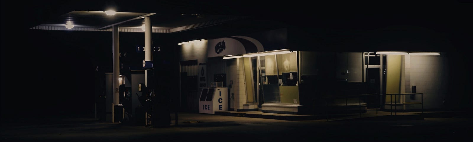 An old gas station at night in the countryside