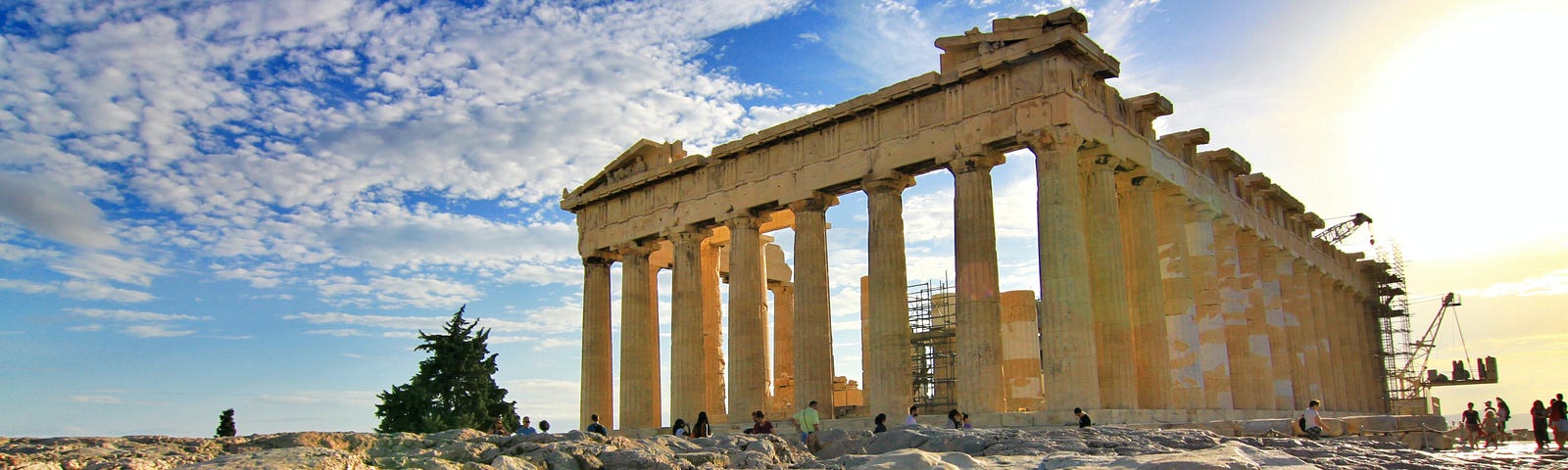 Photo of the Parthenon ruins on a mostly sunny day