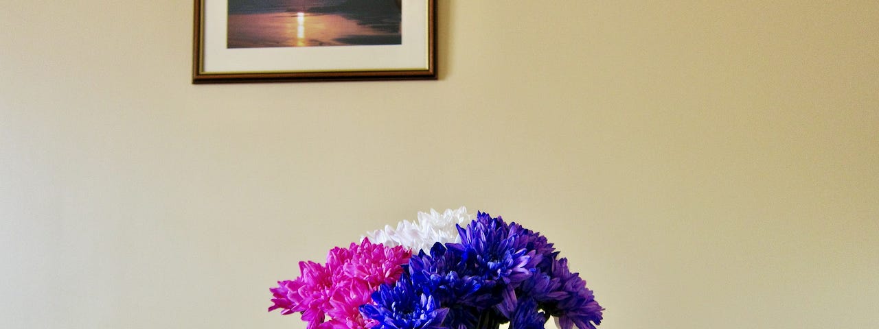 Purple pink and white flowers on a table indoors