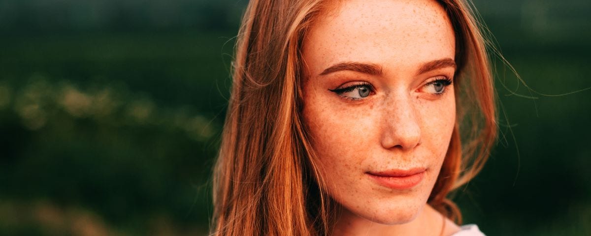 Woman with red hair and freckles