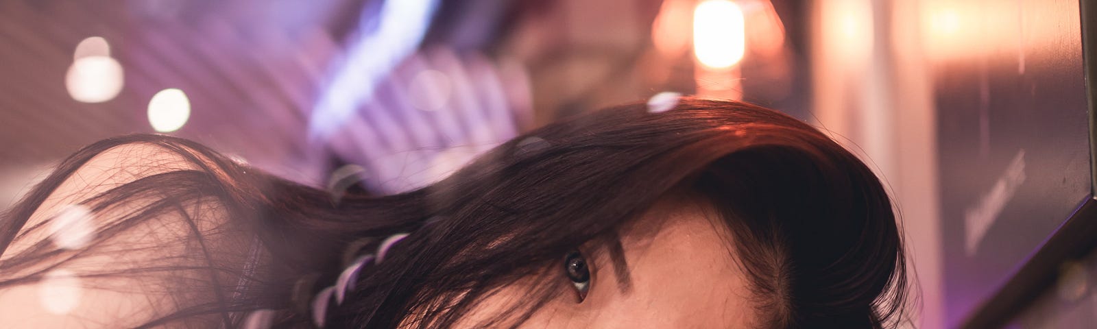 Young woman lying on her arm under soft light