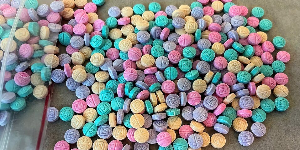 Rainbow-colored round pills sold on the street as Fentanyl.