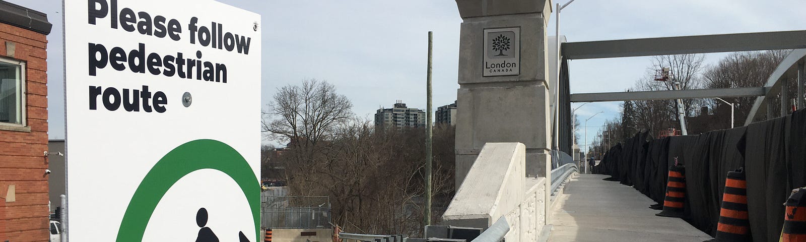 sign announcing pedestrian route across new bridge