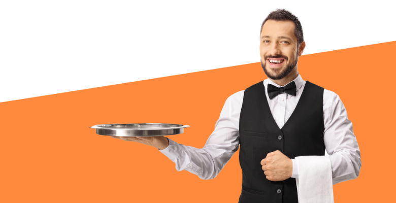 Smiling waiter holding a tray.