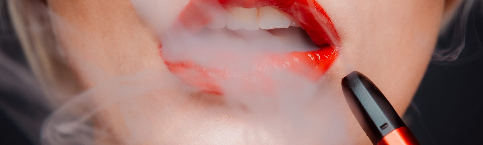 Woman smoking an e-cigarette.