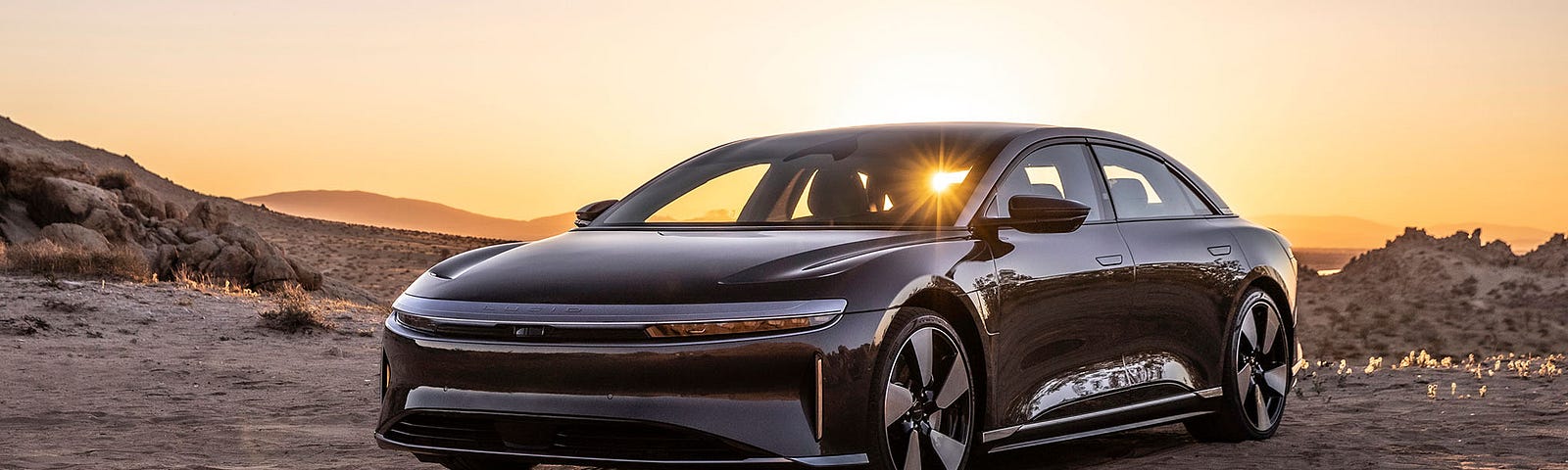 Image of Lucid Air automobile in front of sunset.