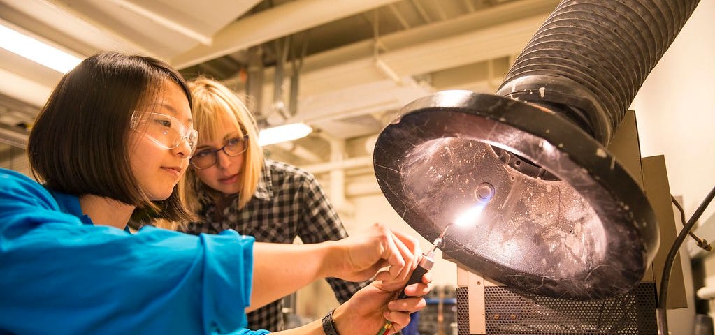 Two women engineers working in a foundry