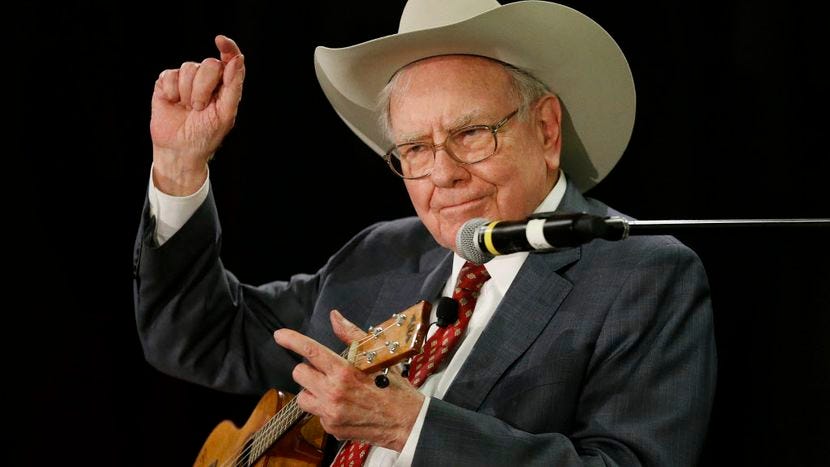 Warren Buffett wearing a cowboy hat and playing a guitar in Dallas