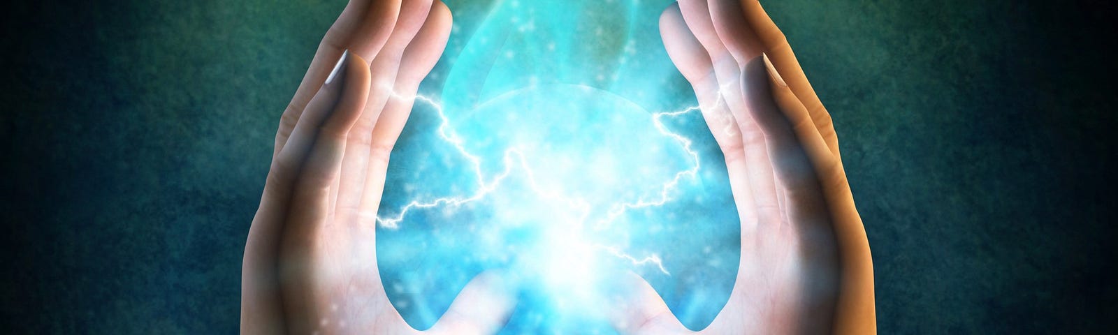 Two hands held in the air facing each other with lightning ball in the middle