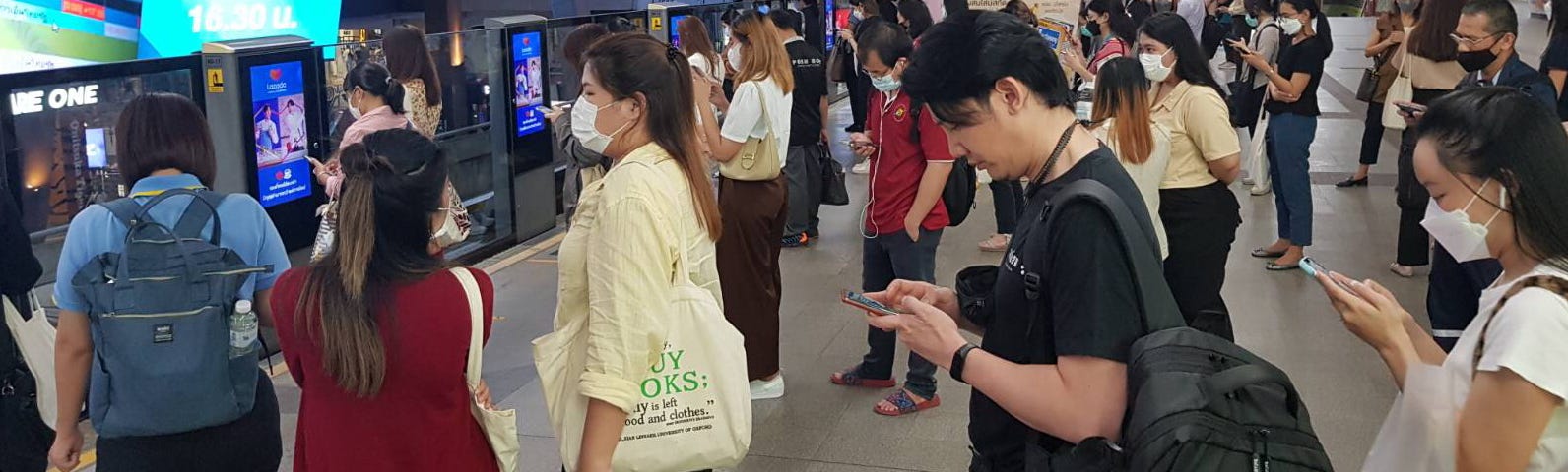 People lining up for the Bangkok Skytrain