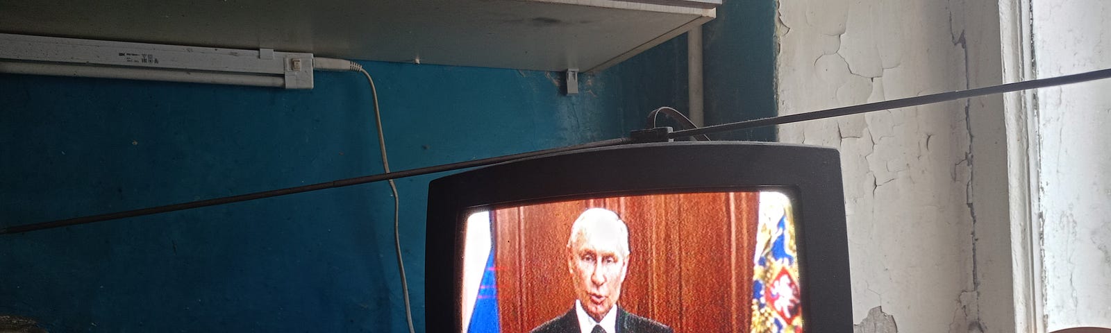 Vladimir Putin, President of Russia, is seen on TV as he addresses Russian citizens about PMC Wagner in June 2023.
