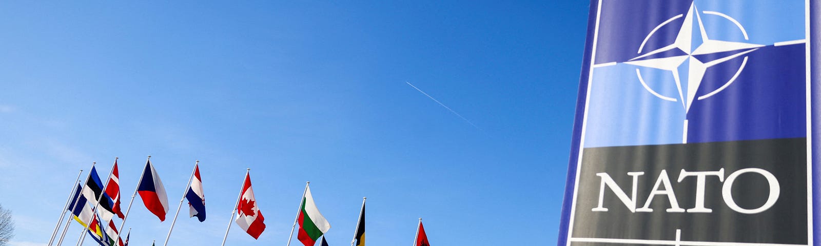 Flags flutter at NATO headquarters in Brussels, Belgium, April 4, 2023. Photo by Johanna Geron/Reuters